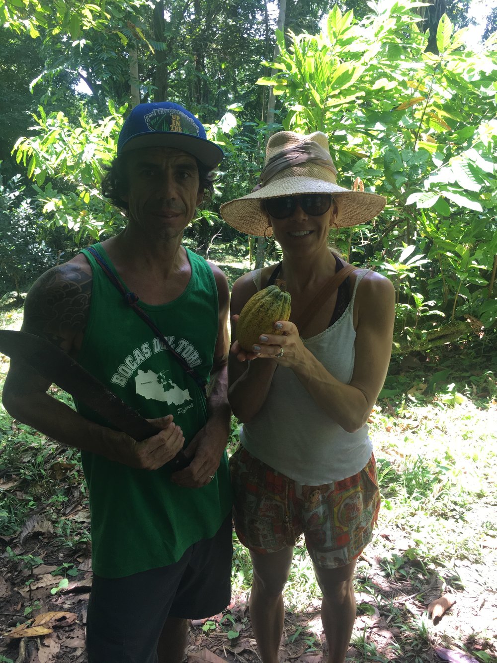 At Up in the Hill organic farm, Isla Bastimentos, Bocos del Toro, Panama holding a cacao pod