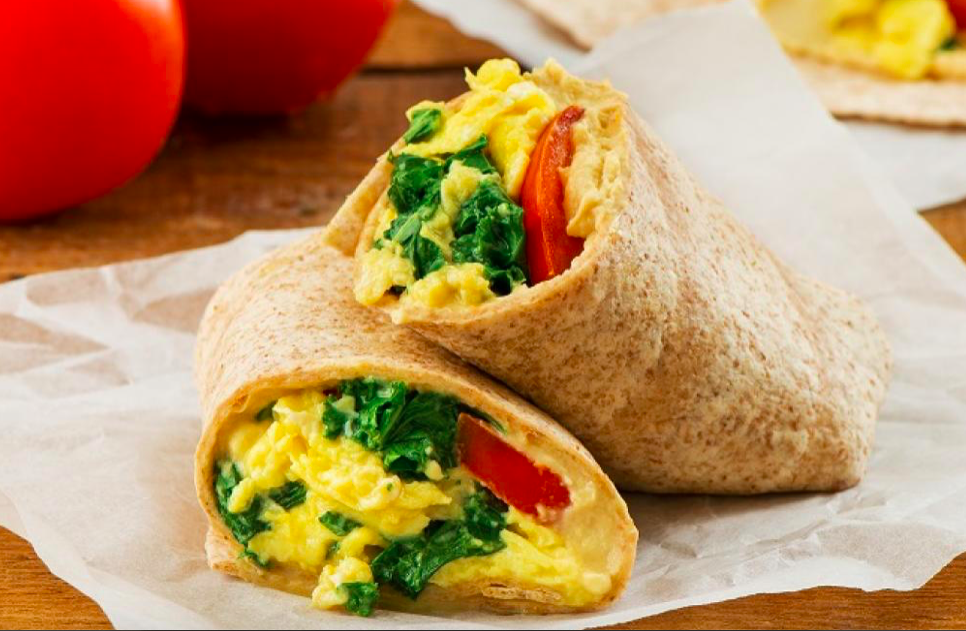 Balanced breakfast: eggs (protein) + whole grain tortilla (carbs) + fiber rich spinach or kale and tomatoes!