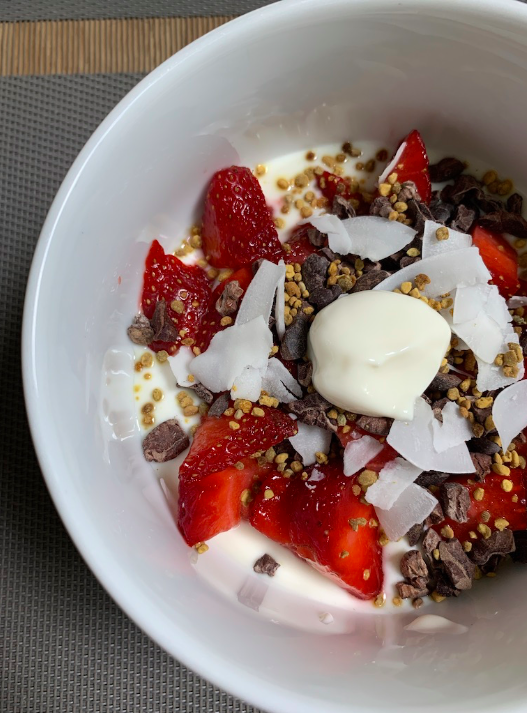 LYB with strawberries, cacao nibs, bee pollen and large flaked shredded coconut